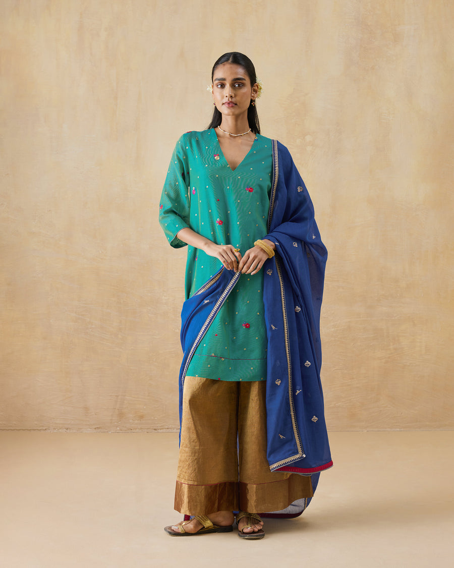 The Twilight Kurta worn with gold Charisma Pants and the blue Leher Dupatta.