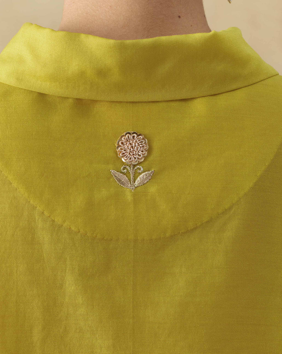Close-up of the zardozi flower in the moon patch at the centre back of the Hala Tunic.