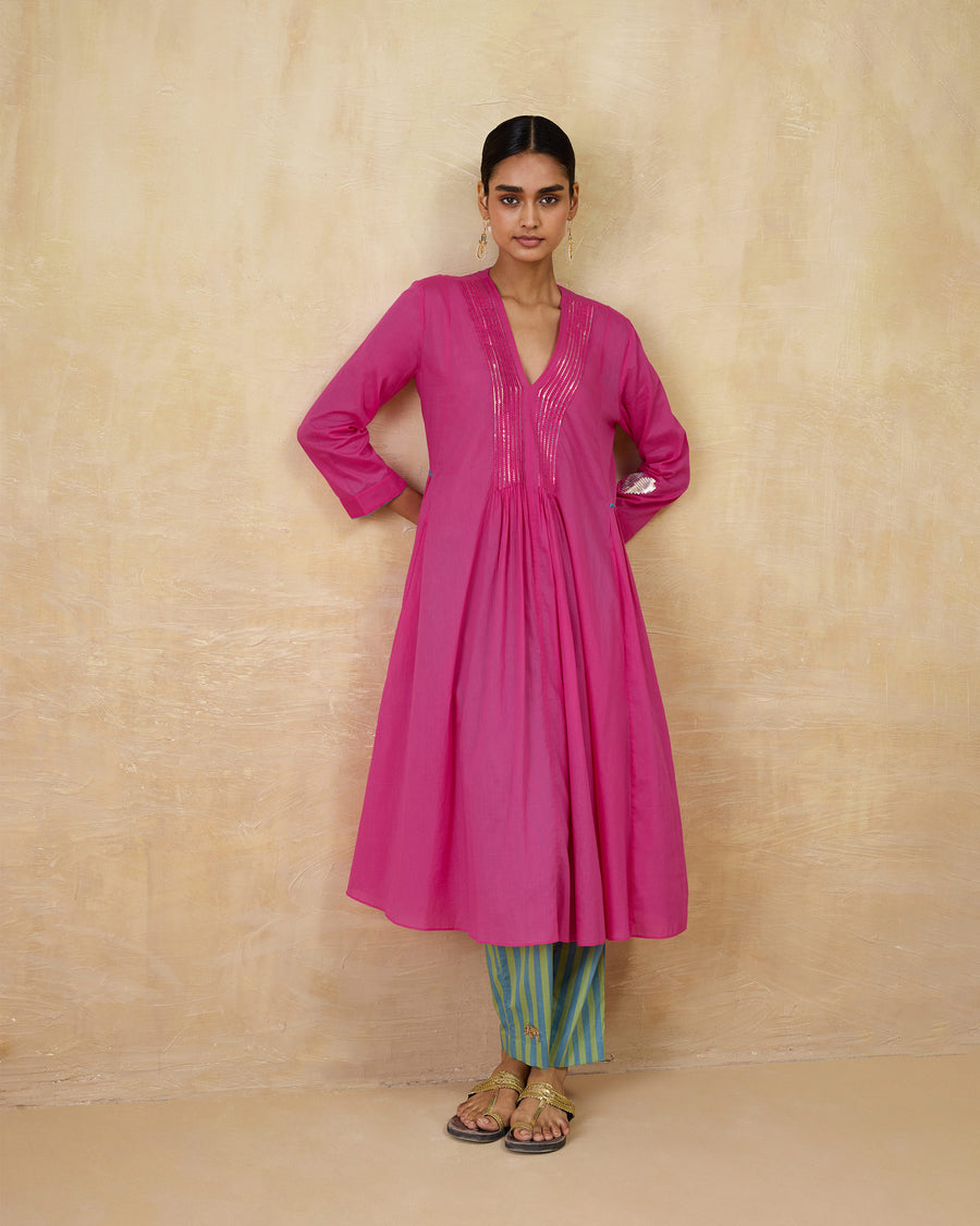 The Pintuck Kurta worn over striped Arzoie Pants.