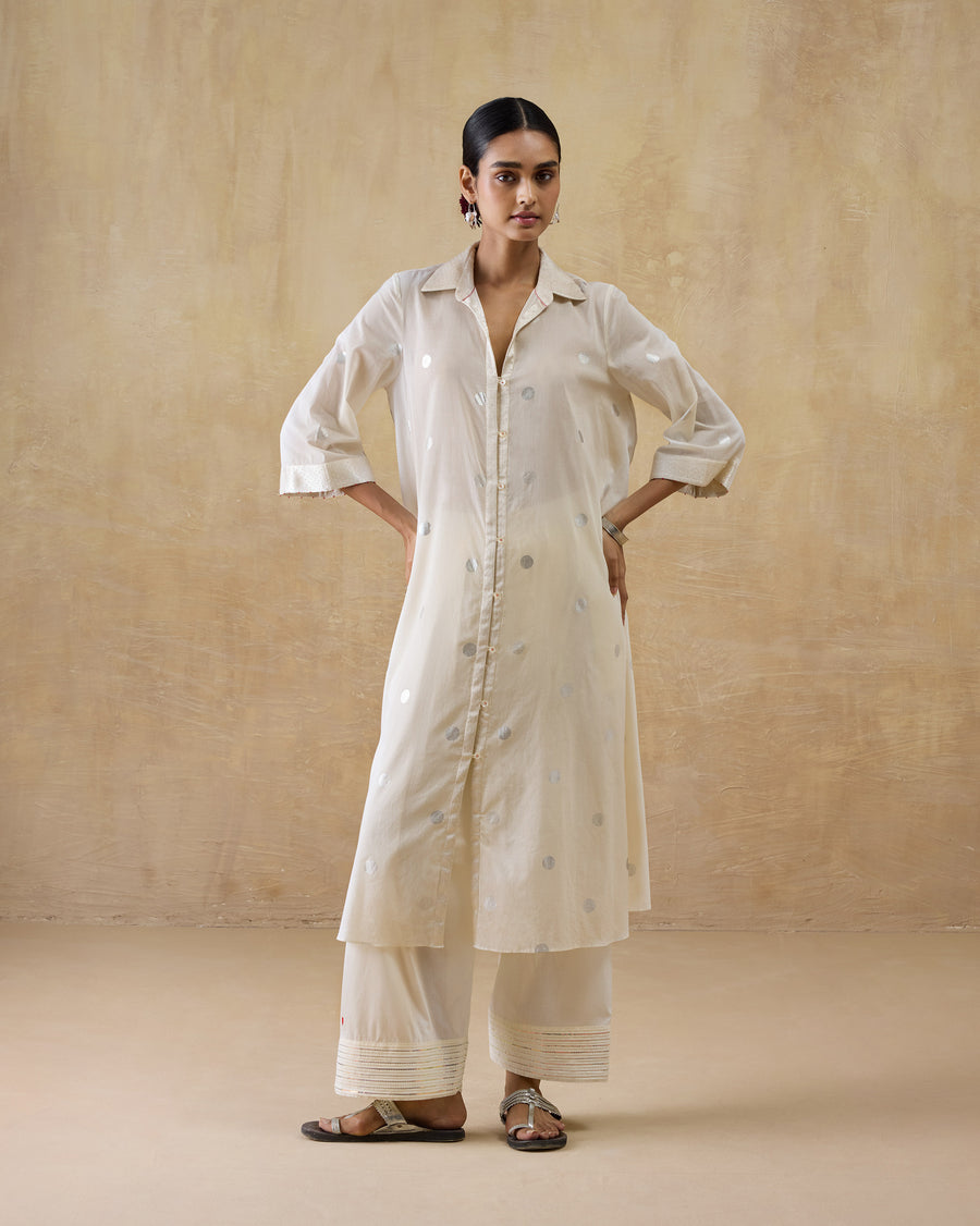 The Numa Pants worn under the ivory Rejoice Kurta.
