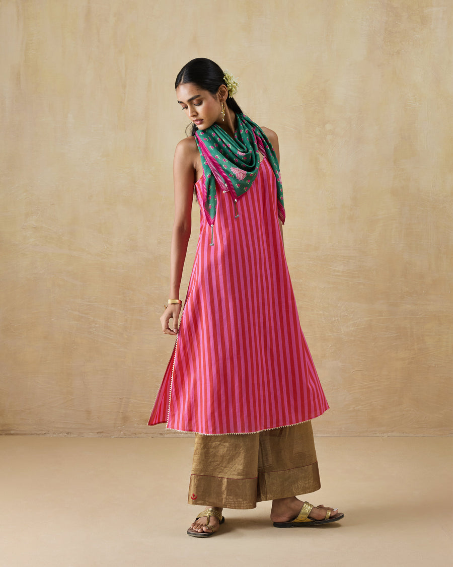 The Mist Camisole worn over wide trousers with a scarf at the neck.