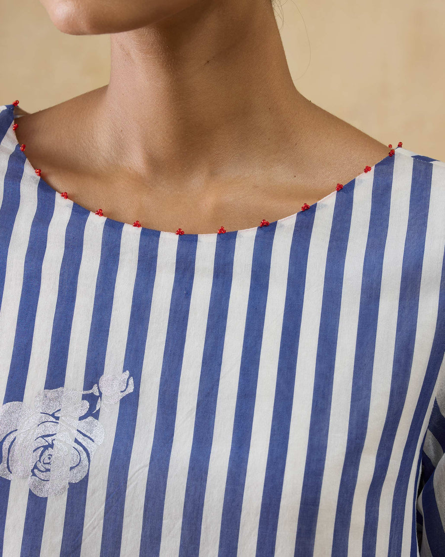 Close-up of the boat neckline of the Boat Neck Kurta, edged in small red beads.