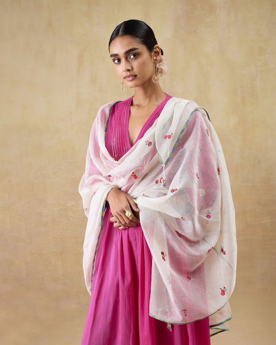 The Swish Dupatta, a sheer ivory kota dupatta with embroidered roses, draped over both shoulders above a pink kurta.