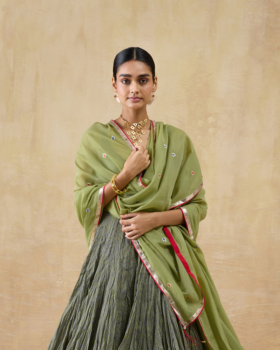 The Cauvery Dupatta, a green cotton silk dupatta with anar embroidery and a gota border, draped over the Kochi Kurta.