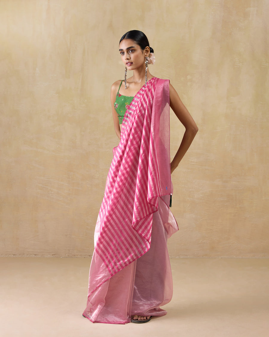 The Blush Sari seen at an angle with a green blouse.