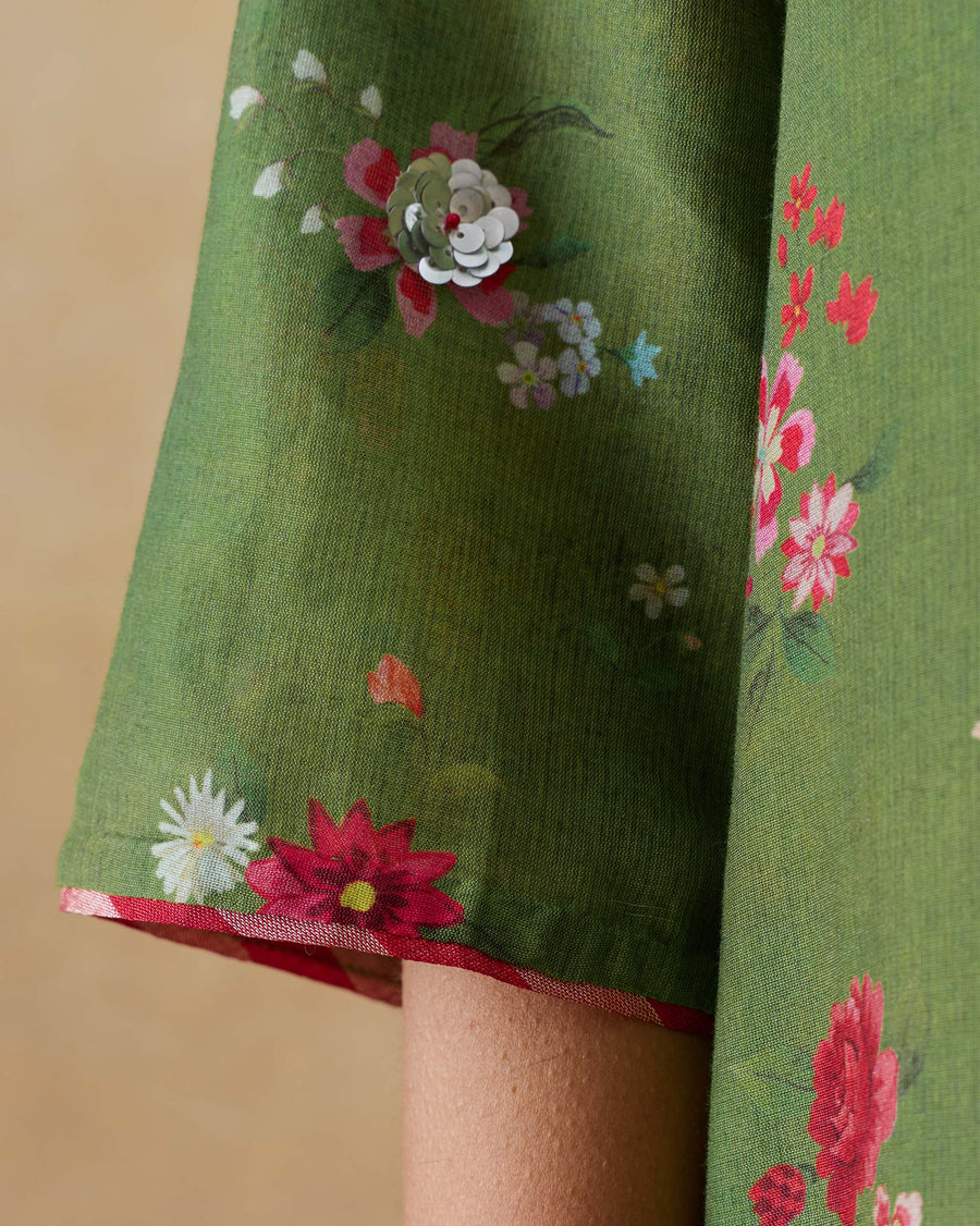 Close-up of the sleeve of the Cascade Kurta, with a sequin flower over the Guldasta print.