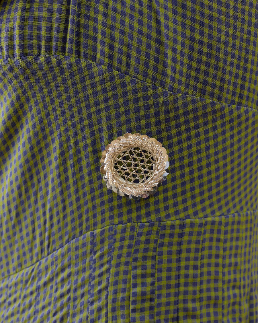 Close-up of the bodice of the Kochi Kurta: one antique gold jali flower sequin on tiny lime and purple checks.