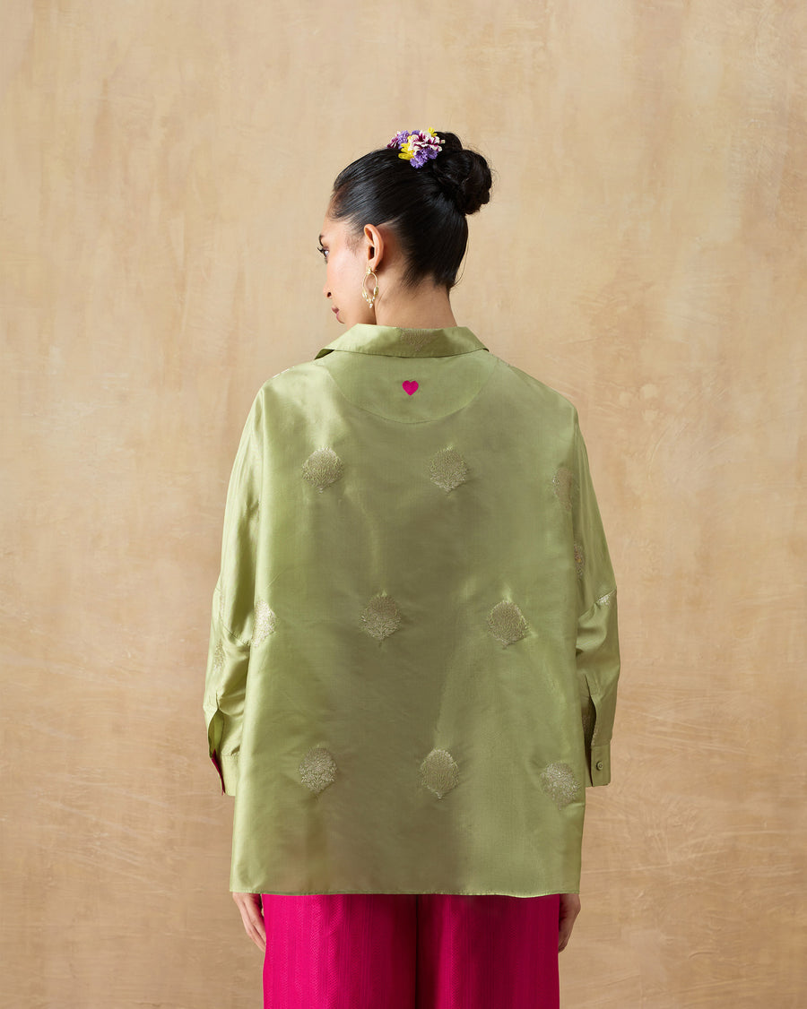 Back view of the Boxy Shirt, showing gold butta motifs woven into leaf green silk brocade.