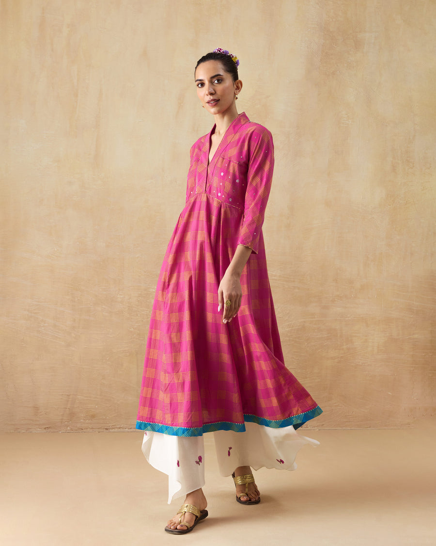The Drifter Kurta worn over ivory Raahi Pants with heels, the flare caught mid-step.