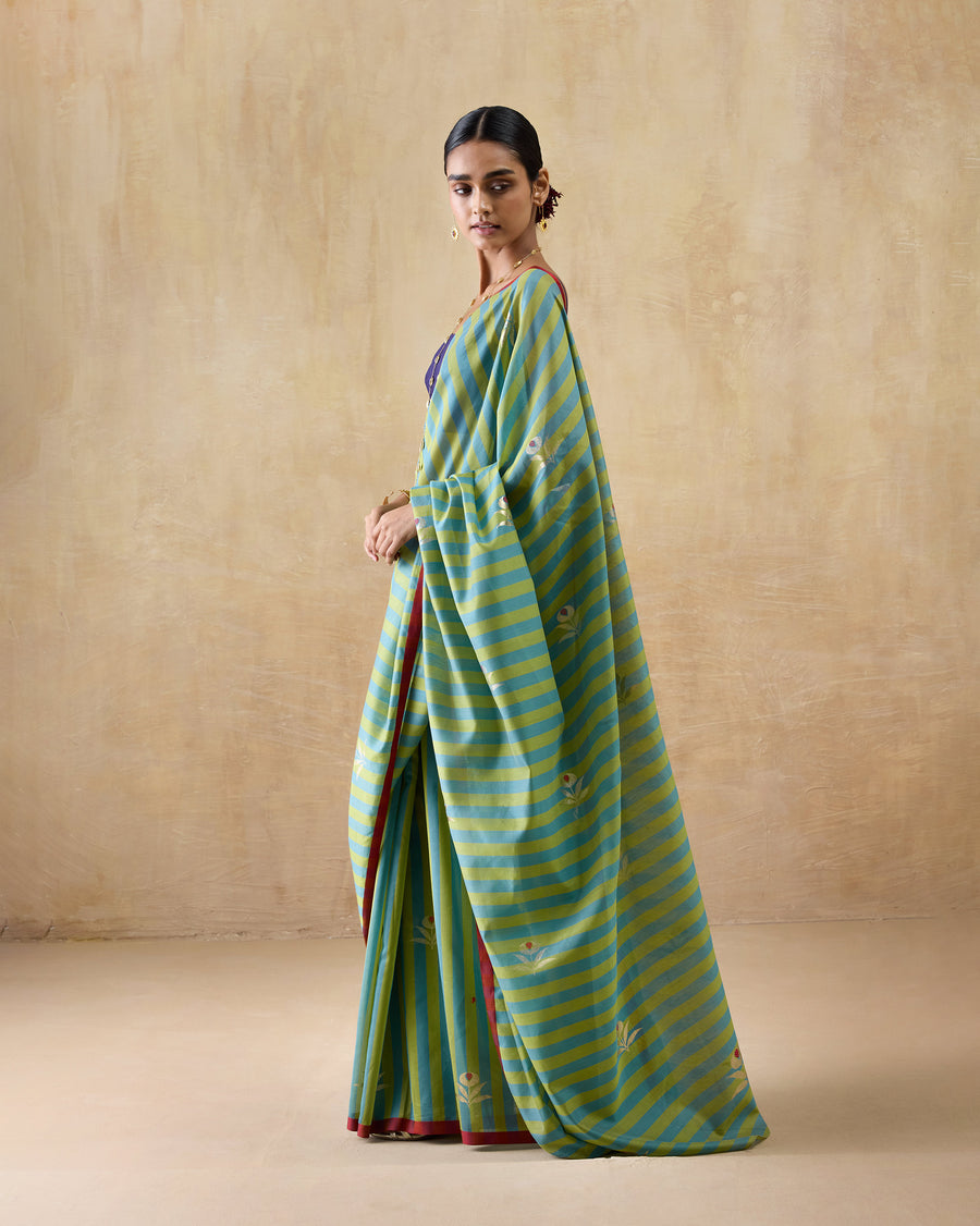 The Garden Party Sari draped over the arm, showing the full pallu and gold foil tulip print.