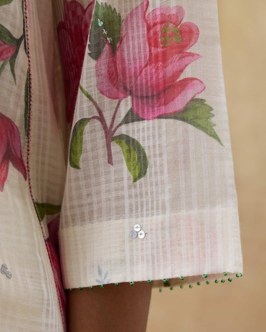 Close-up of the sleeve of the Fiesta Kurta, showing a chintz rose on kota checks with green beads at the hem.