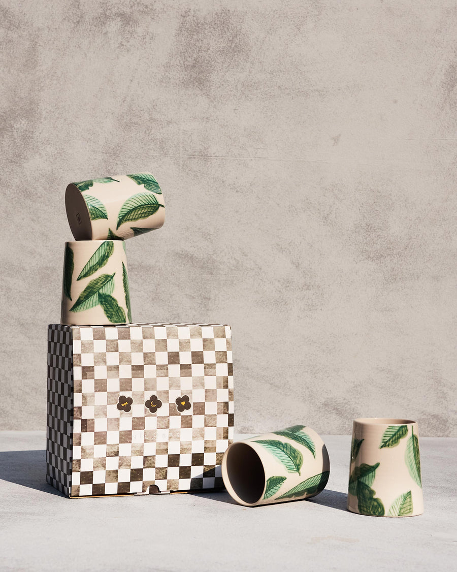 Galle Kulhars beside a checkered gift box.