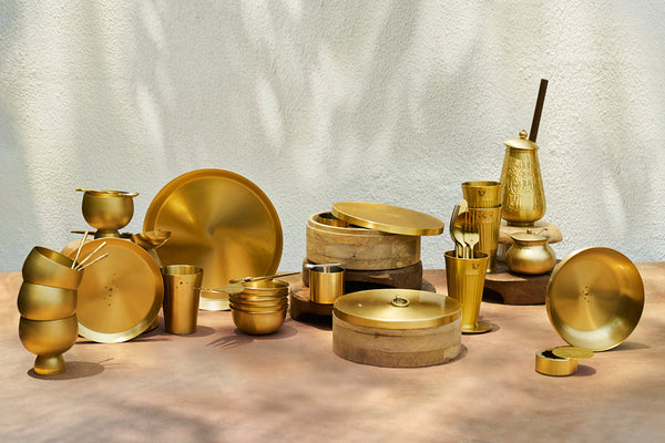 The thali among other brass tableware