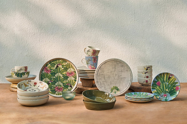 The plate among other tropical dinnerware