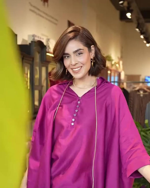 Roohi Marjara in the mulberry Hala Tunic and matching pyjamas, with a long gold Phool Chain