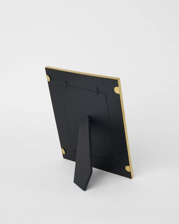 The back of the frame with its black easel stand