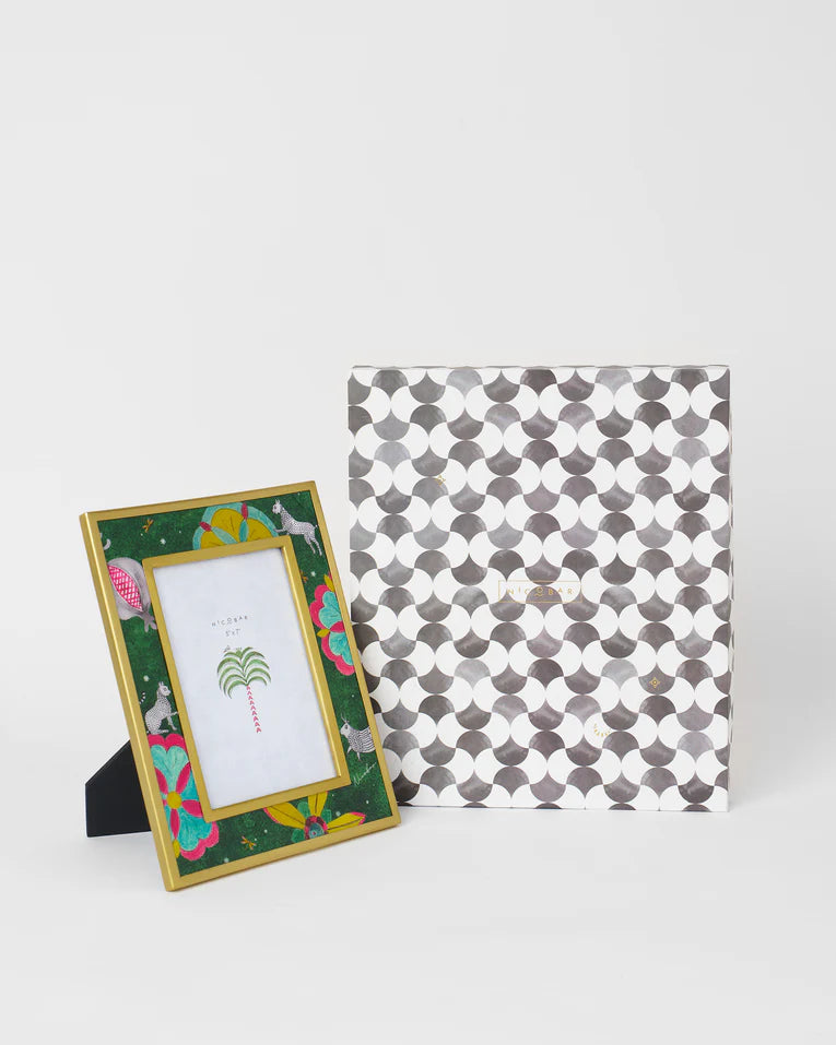 The frame beside its grey and white patterned gift box