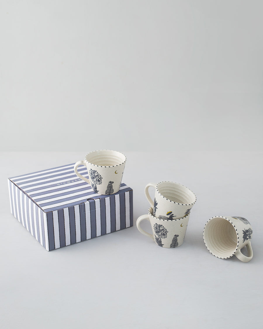 Haathi Sher mugs beside a navy and white striped gift box