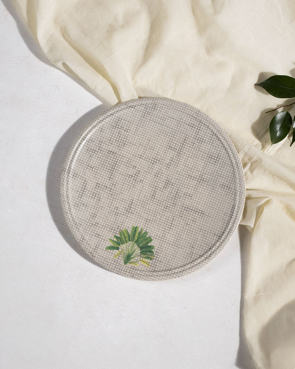 The plate from above with a palm frond
