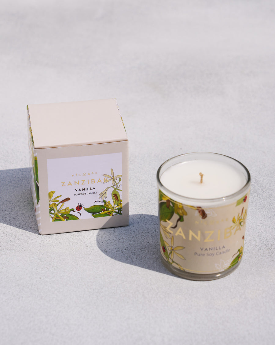 The Zanzibar Jar Candle beside its cream box.