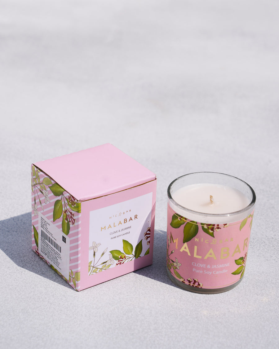 The Malabar Jar Candle beside its pink box.