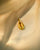Cowri shell charm