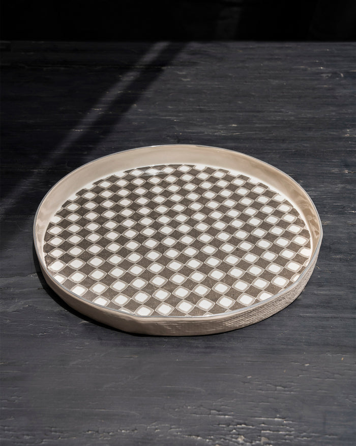 Taramandal Platter with a grey and white diamond pattern, seen from above.