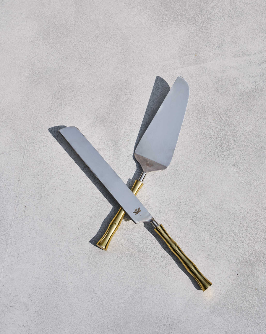The cake knife and server crossed.