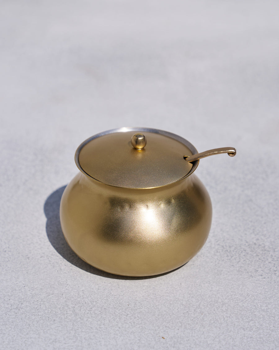 The rounded Madhu Ghee Pot with lid and ladle.