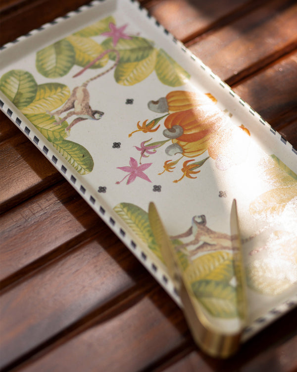 Close view of monkeys and orange flowers on the tray
