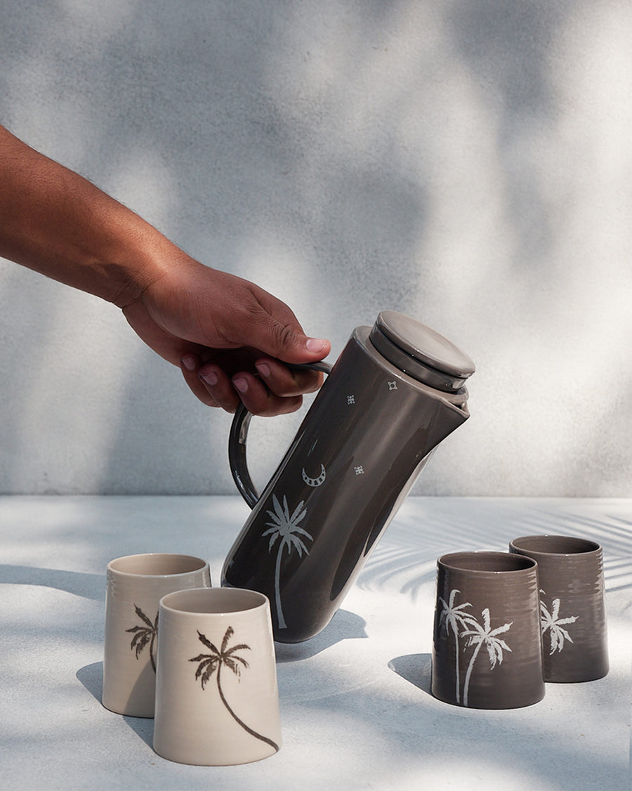 The Taramandal Carafe pouring into cups.